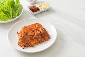 grilled pork marinated Kochujang sauce in Korean style with vegetable and kimchi photo