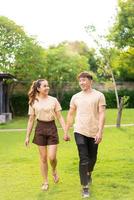 Asian couple love dating in park photo