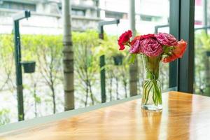 rose flower in vase decoration on wood bar photo
