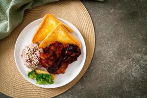 barbecue pork steak with rice berry photo