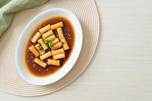 Spicy Jjajang Tteokbokki or Korean rice cake in spicy black bean sauce photo