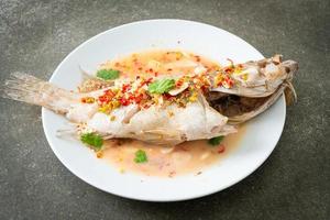 Steamed grouper fish with lime and chillies photo