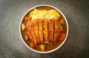 curry rice with fried pork cutlet and creamy omelet photo