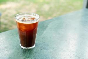 iced americano coffee glass on table photo