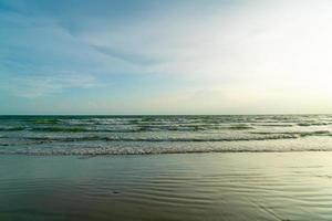 beautiful sea beach with sunset time photo