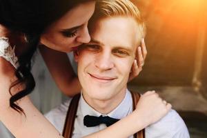 Bride leaning on the groom photo