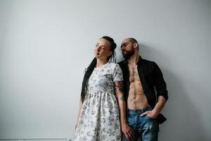 man and woman on a white wall photo