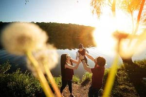 young family with a child on the nature photo