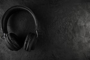 Headphones on a black stone background photo