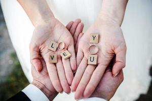 Cute message Love you in hands . photo