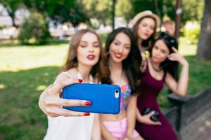 four beautiful young girls make selfie photo