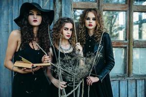 three vintage women as witches photo