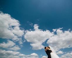couple on blue sky background photo