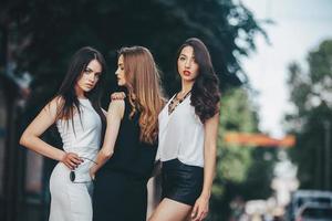 pretty girls posing in a city street photo