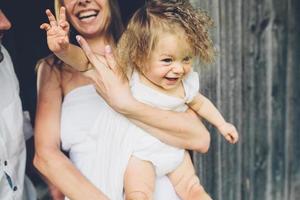 mother, father and daughter together having fun photo