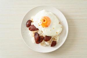 rice with fried egg and Chinese sausage photo