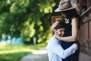 man and woman embracing each other photo