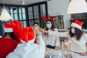 Multi-ethnic young people celebrating New year eve at party photo