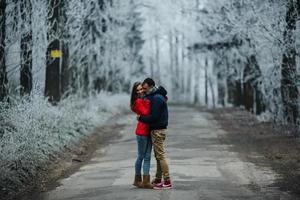 couple walking on a winter park photo