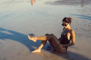 A young woman enjoying the natural mineral mud photo