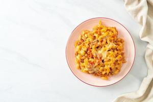 homemade macaroni bolognese with cheese photo