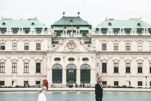 Wedding couple on a walk in the estate of the Belvedere in Vienna photo