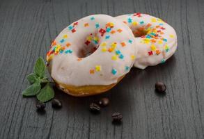 Donut on wooden background photo