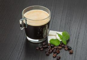Espresso on wooden background photo