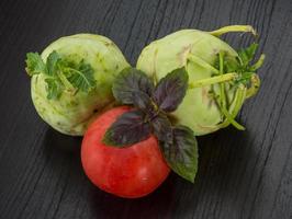 Kohlrabi on wooden background photo