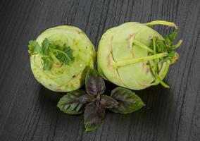 Kohlrabi on wooden background photo