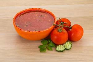 Gaspacho in a bowl on wooden background photo