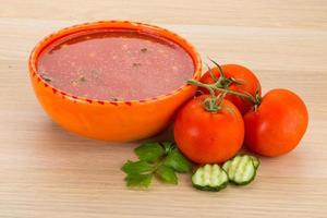 Gaspacho in a bowl on wooden background photo