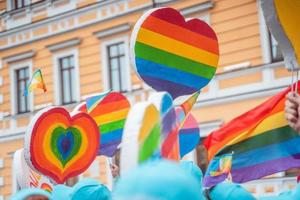 People carry lgbt hearts at the LGBT parade photo