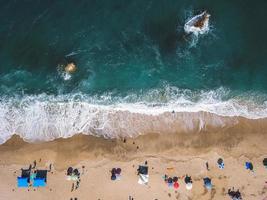 Beach with sun loungers on the coast of the ocean photo