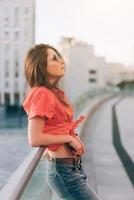 Young girl on the city street photo