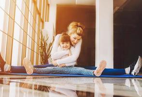 Mother and daughter hugs photo