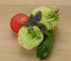 Kohlrabi on wooden background photo