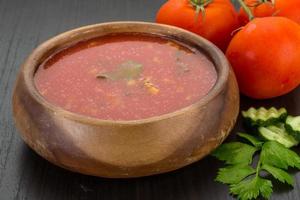 Gaspacho in a bowl on wooden background photo