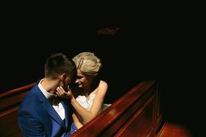 bride and groom illuminated by light photo