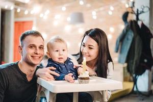 Mom dad and little son spend time together photo