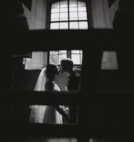 bride and groom on the background of a window. photo