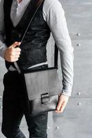 handsome guy with leather bag photo