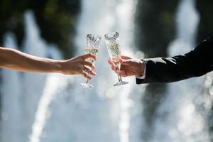 Cheers of bride and groom photo