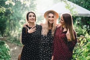 Three girls are photographed on camera photo