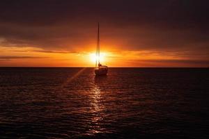 Aerial view from drone on boat shipping in sea, sunset photo