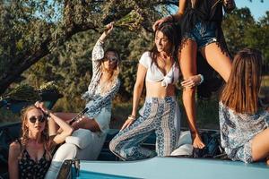 Five girls have fun in the countryside photo