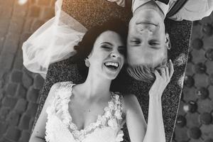 Bride and groom having fun photo