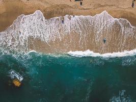 Beach with sun loungers on the coast of the ocean photo