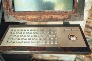 Very old computer, rusty keyboard with monitor photo