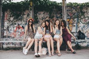 Five beautiful young girls relaxing photo